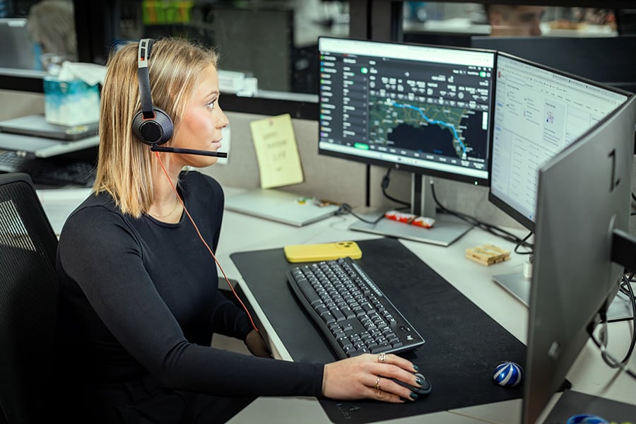 Female on computer looking freight tracker