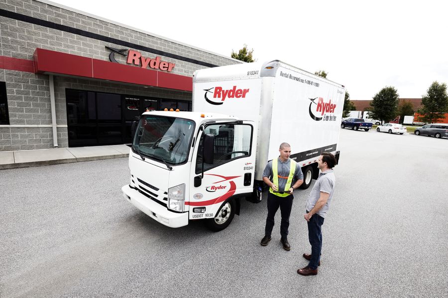 Ryder employee and customer viewing a truck
