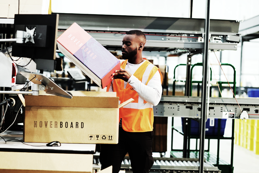 Ryder employee packaging a product