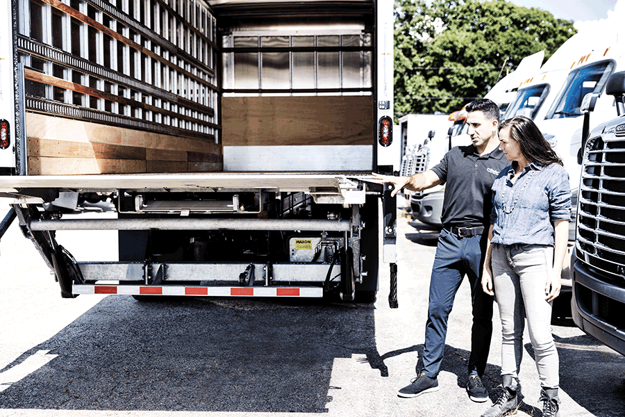 Customer looking at trailer with Ryder employee
