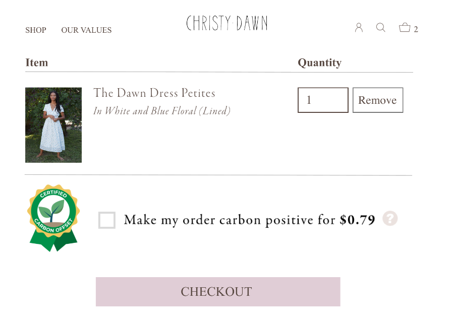 the checkout page for christy dawn’s site showing the option to make the order carbon positive.