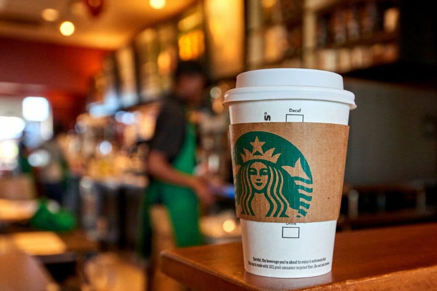 A starbucks cup inside a Starbucks location.