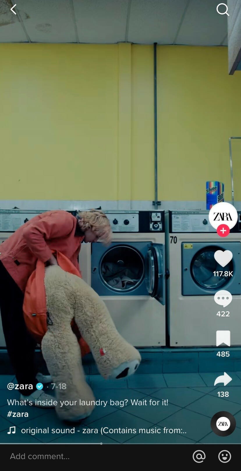 A zara tiktok video showing their customer stuffing a bear into a washing machine