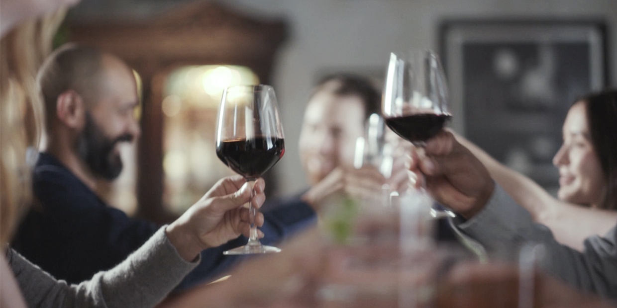 Two people enjoying a glass of wine Two people enjoying a glass of wine