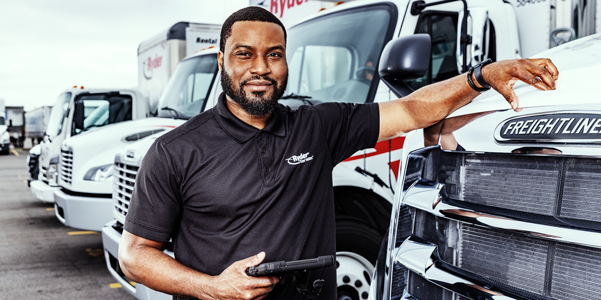 Ryder truck driver in front of his truck