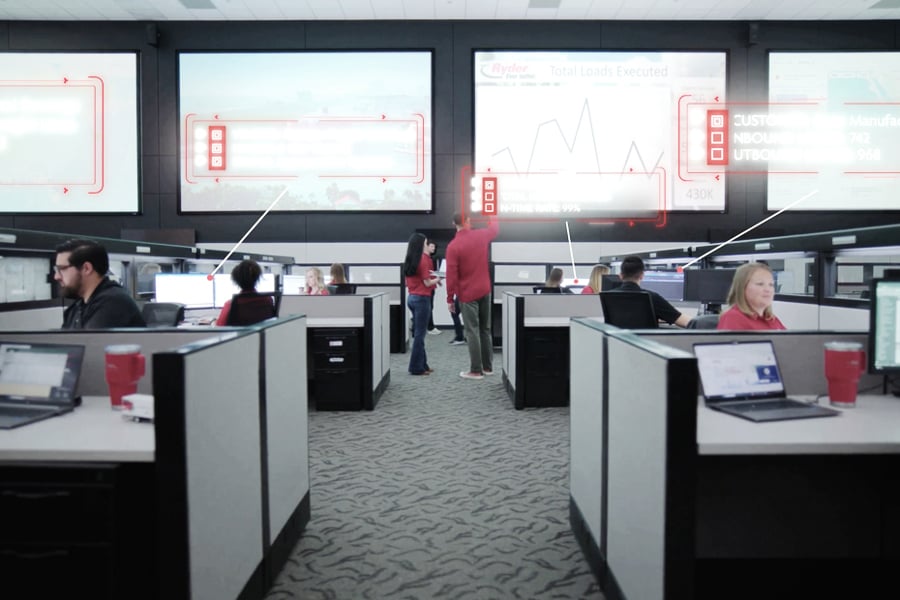 Ryder transportation management team monitoring freight in a logistics control center Ryder transportation management team monitoring freight in a logistics control center