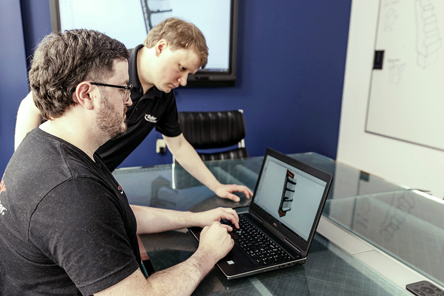 two Ryder display engineers working together