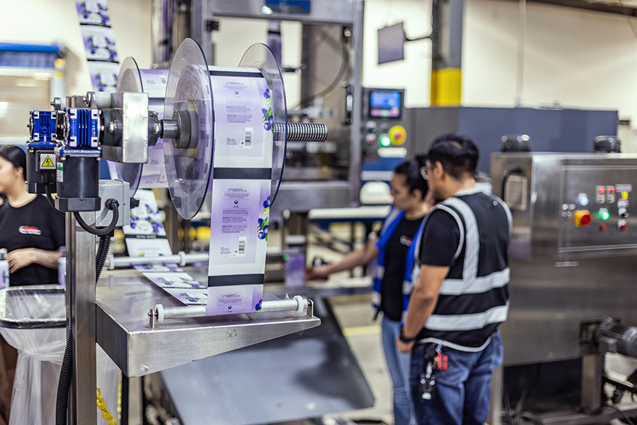 A machine unwinding rollstock packaging