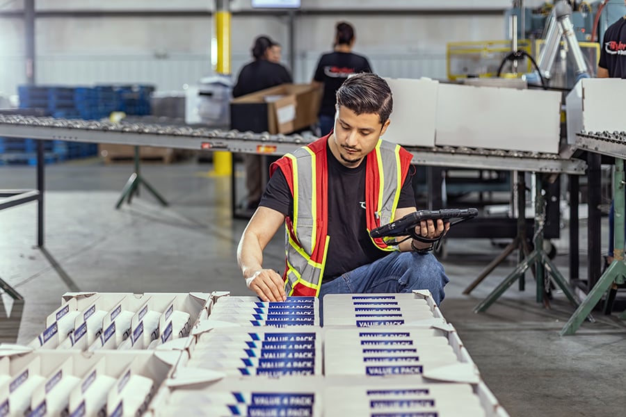 a Ryder employee checking the quality of materials