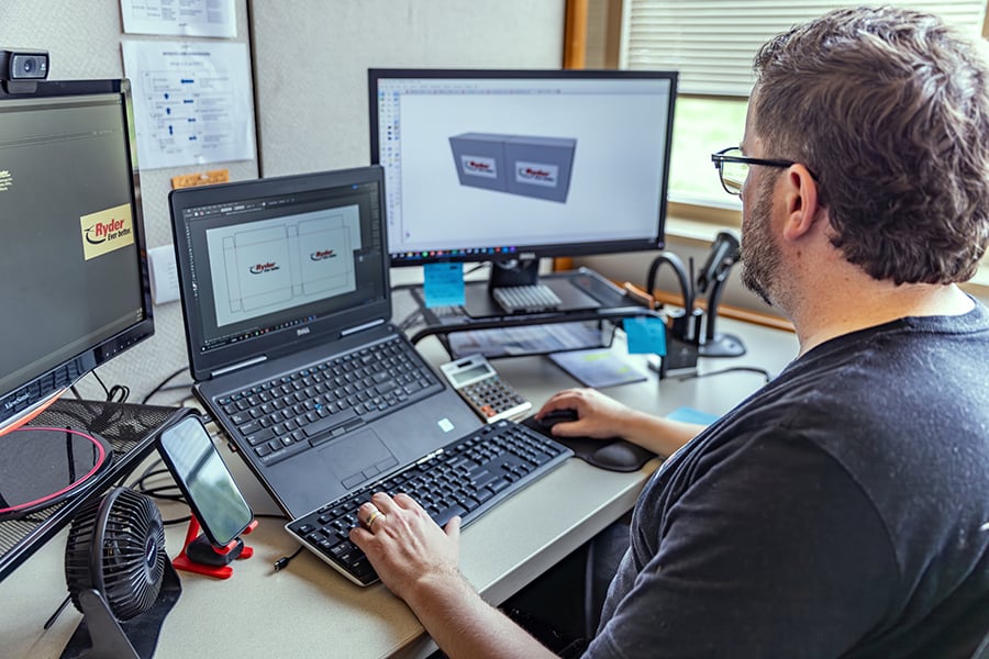 An engineer creating a display design on a computer