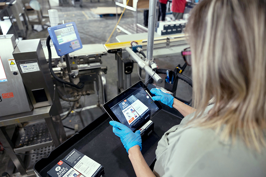 employee preforming quality assurance at a co-packing facility
