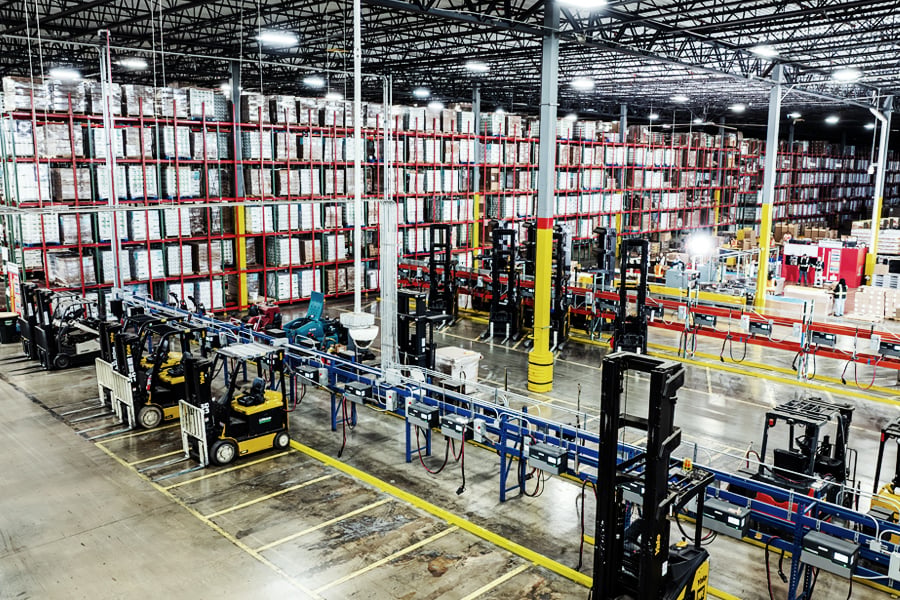 Ryder shared warehouse with stacked pallets and multi-client storage racking