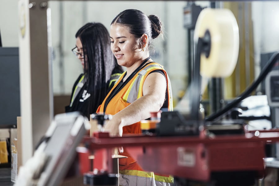 Ryder warehouse team picking and packing orders in a shared facility