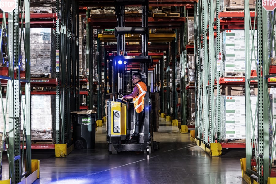 Ryder associate managing inventory in a multi-client shared warehouse