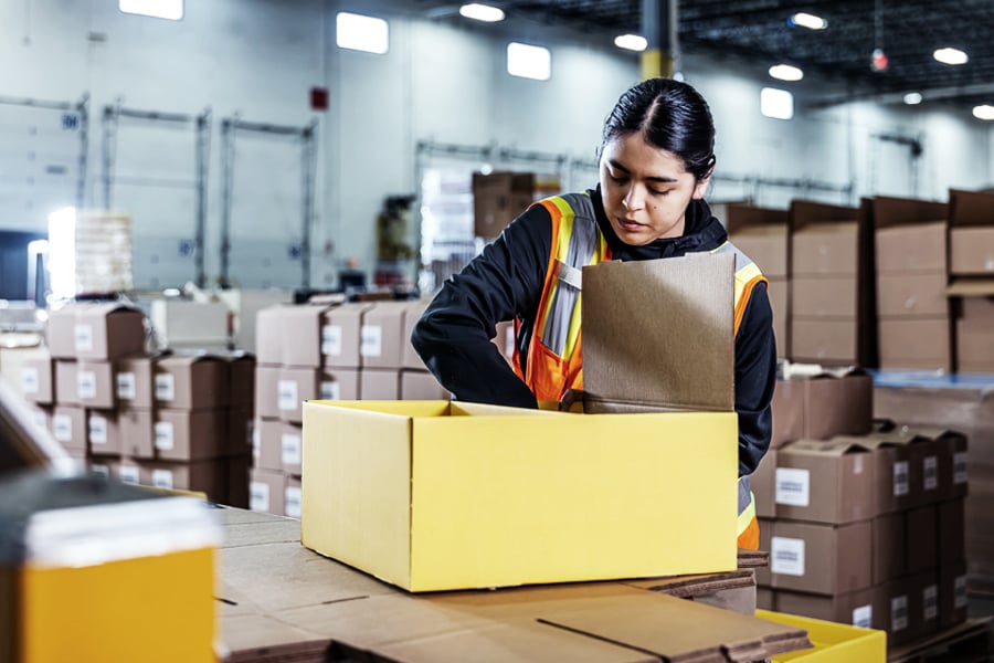 Ryder associate performing kitting and packaging value-added services