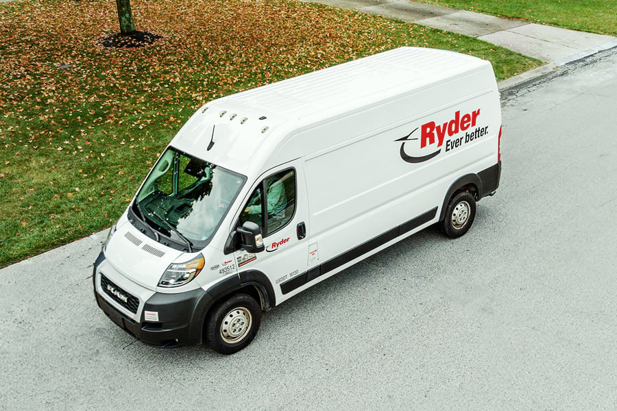 White Ryder cargo van available for commercial truck rental parked on the street White Ryder cargo van available for commercial truck rental parked on the street