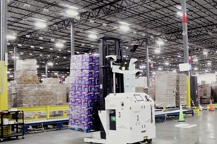 Automated guided vehicle (AGV) moving pallets along a fixed warehouse route