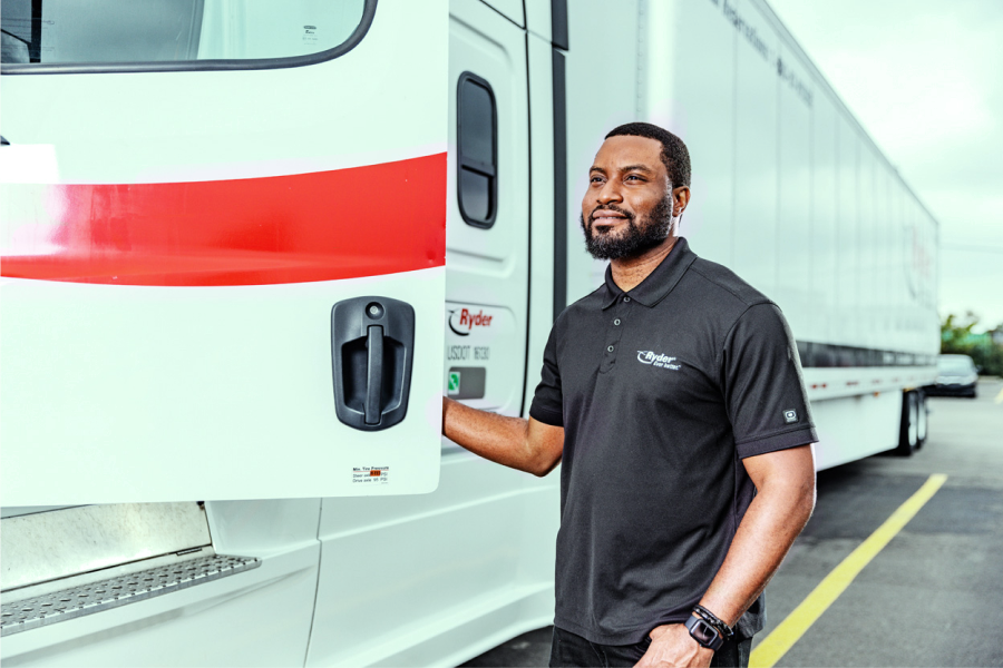 Dedicated transportation solutions driver stepping into truck