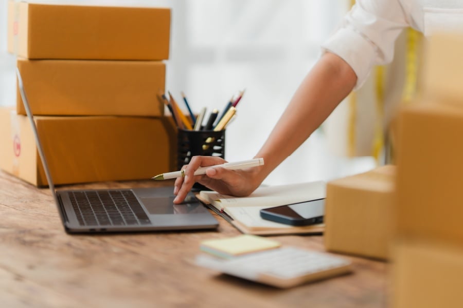 Scaling E-commerce Fulfillment Without Breaking Your Supply Chain e-commerce seller preparing orders for fulfillment