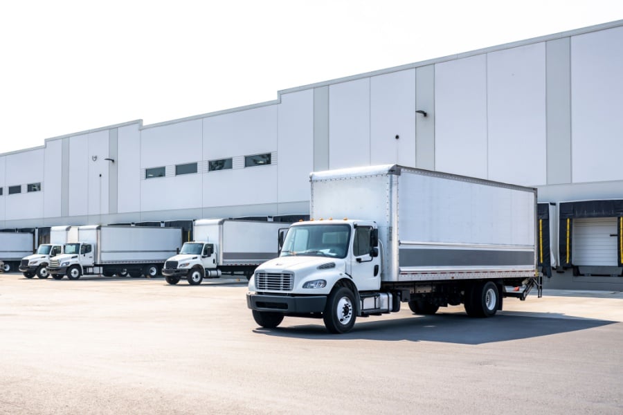 What Is My Fleet’s Total Cost of Ownership? Medium duty trucks at a warehouse