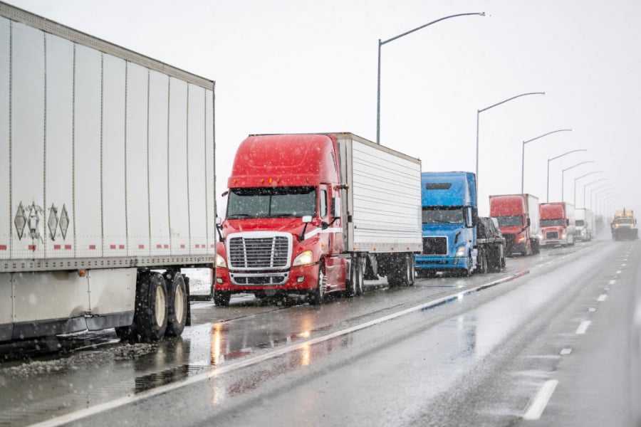 commercial trucks on icy road commercial trucks on icy road