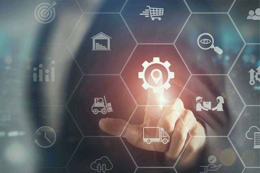 finger pointing to manufacturing gear on abstract image representing nearshoring strategies for supply chains finger pointing to manufacturing gear on abstract image representing nearshoring strategies for supply chains