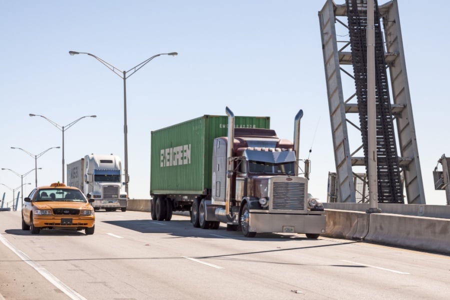 2026 Freight Market & Trucking Industry Trends Semi trucks leaving the Port of Miami highlighting trucking industry trends in freight movement