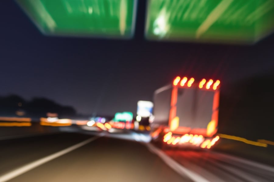 Private Fleet Ownership vs Lease vs Dedicated: Which Works Best for You? Blurred semitruck on the highway