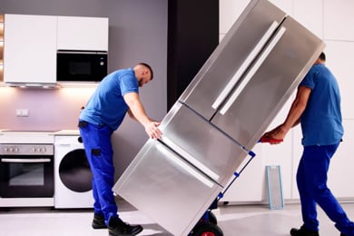 final mile delivery crew installing appliances in a house final mile delivery crew installing appliances in a house